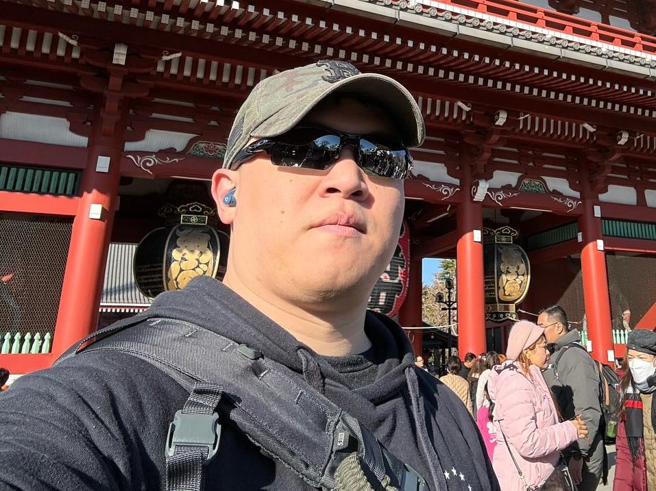 Chris in Oakley shades taking a selfie in front of Senso-Ji temple.