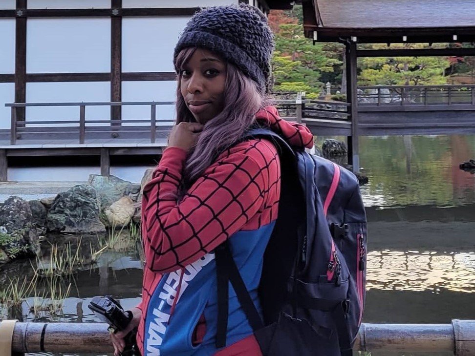 Jounin in frontof the Kyoto Golden Pavillion in her spiderman hoodie.