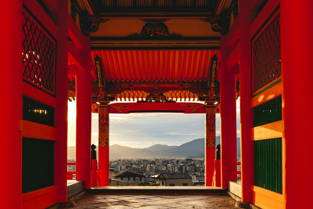 A view from inside one of the buildings in Kiyomizu-dera looking out into the city.